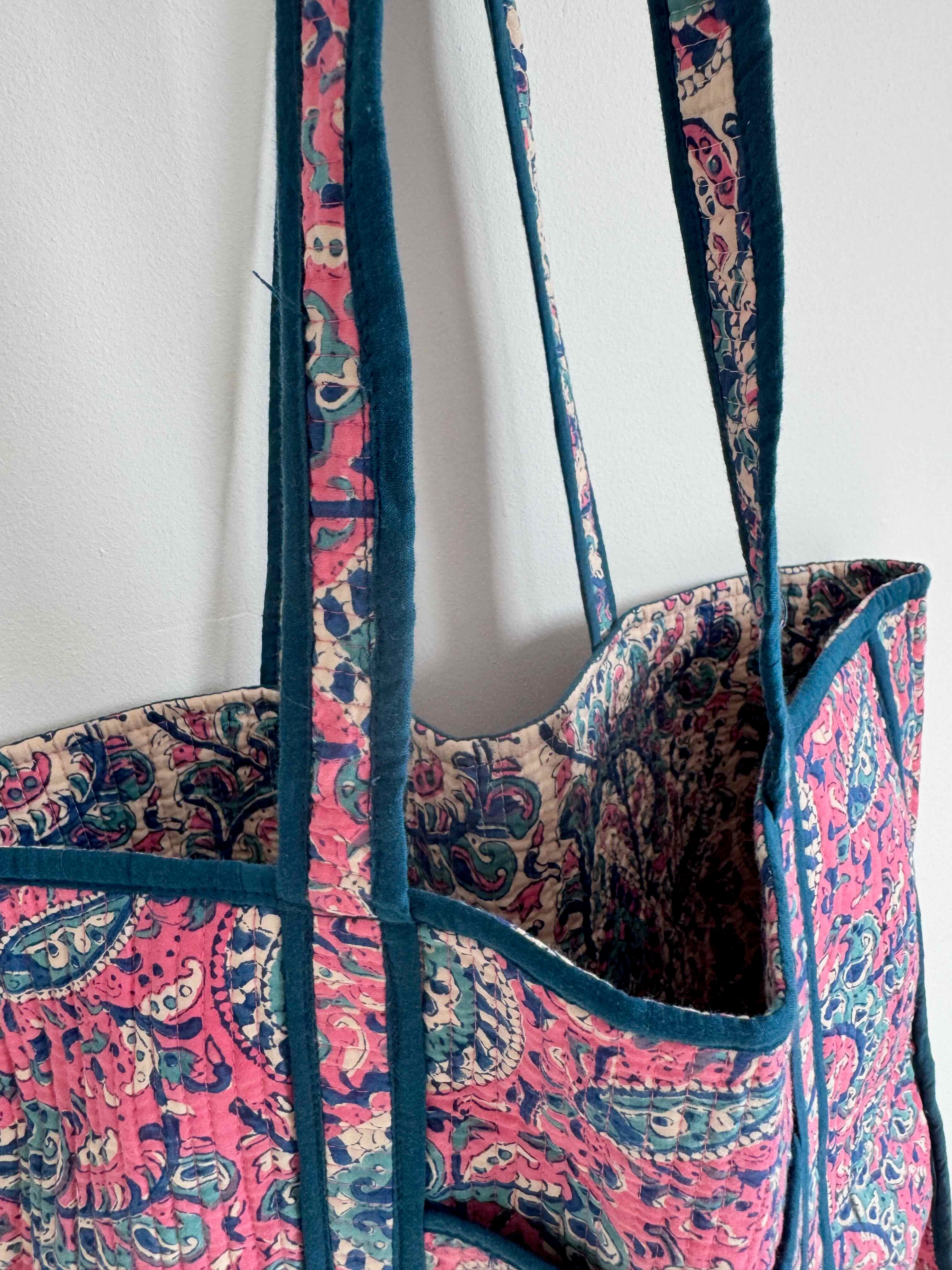 Tote bag with pink and blue paisley pattern on a white background