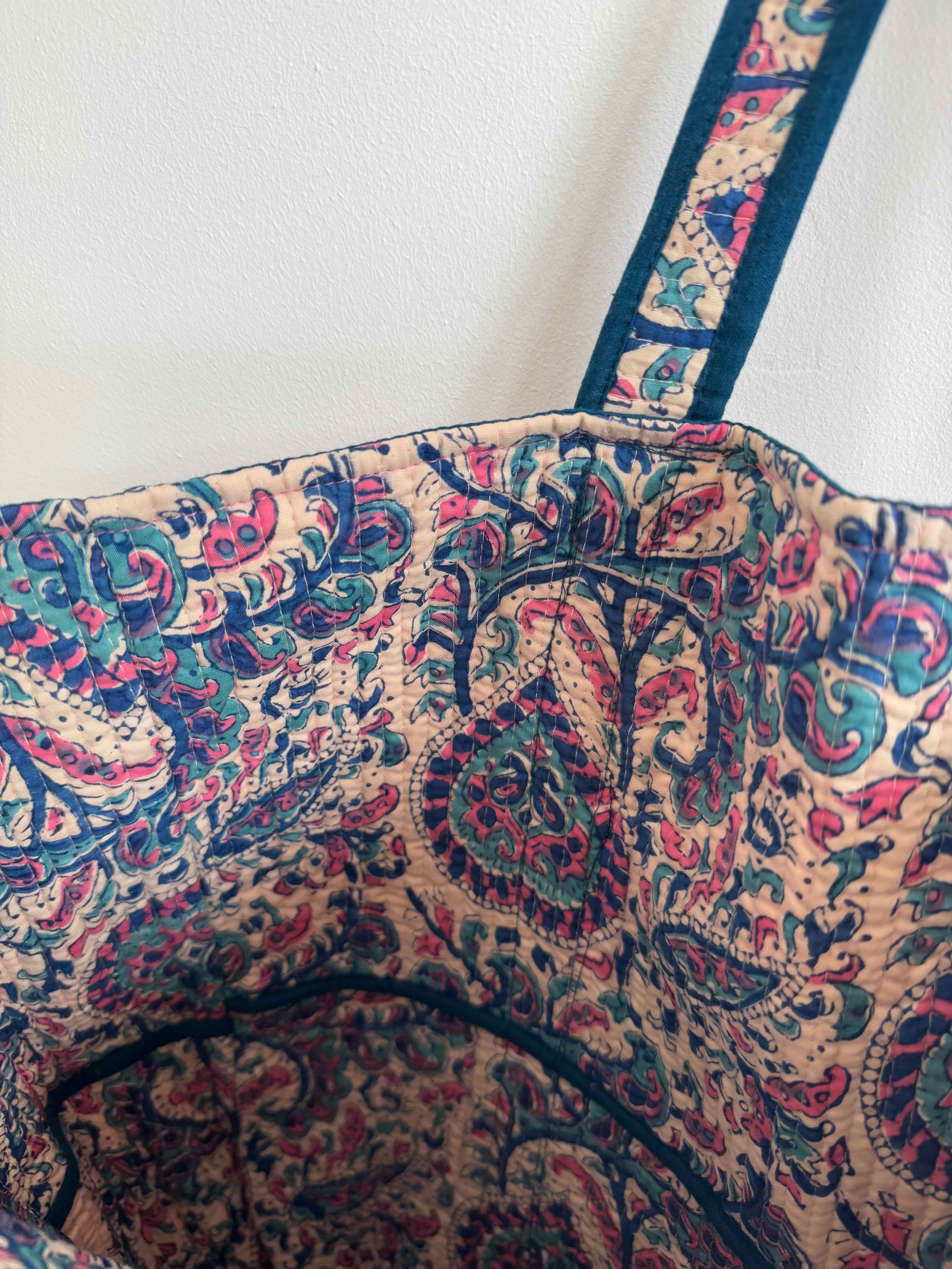 Patterned bag with paisley design on a white background